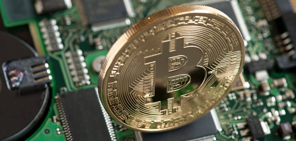 Bitcoin symbol over-top motherboard