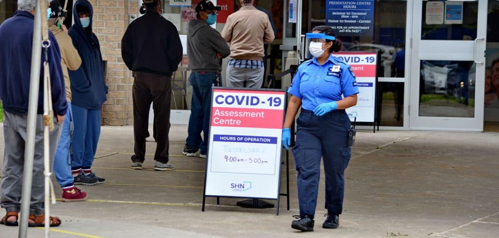 A line of people waiting for COVID-19 testing.