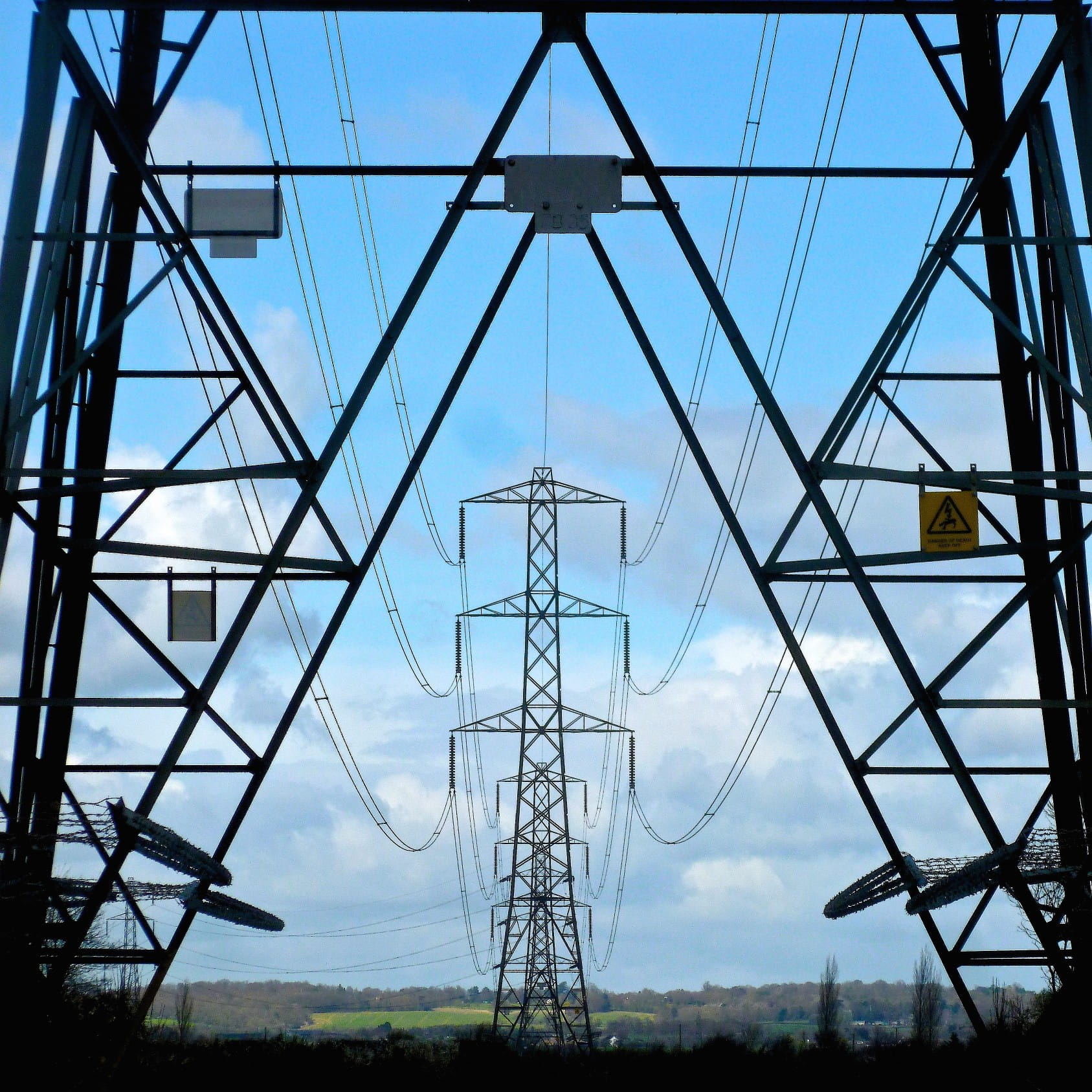 High voltage power towers through the countryside