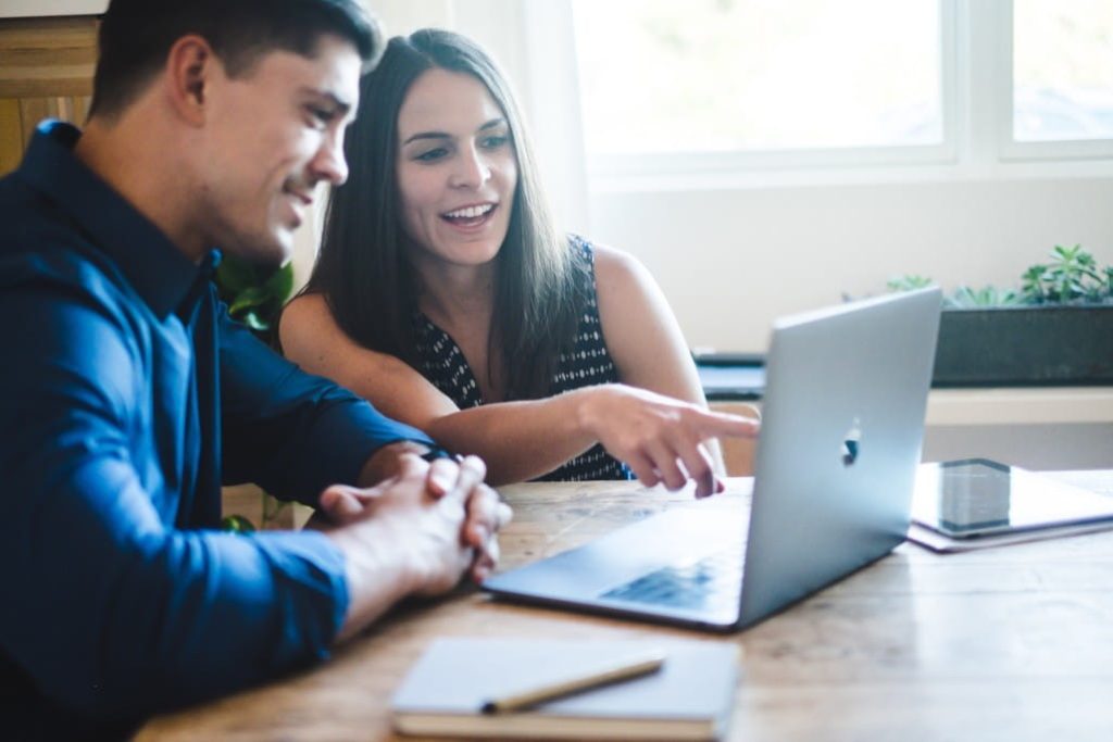 Couple looking at laptop