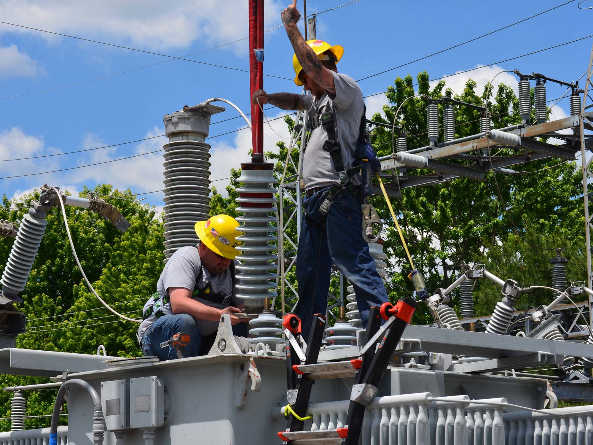 Men working on transformers